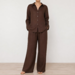 Woman wearing a brown linen co-ord set with button-down shirt and wide-leg trousers, front view