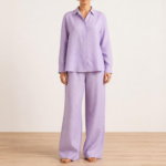 Woman wearing a lavender linen co-ord set with button-down shirt and wide-leg trousers, front view