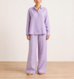 Woman wearing a lavender linen co-ord set with button-down shirt and wide-leg trousers, front view
