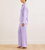 Side view of woman wearing lavender linen co-ord set with wide-leg trousers and flat sandals